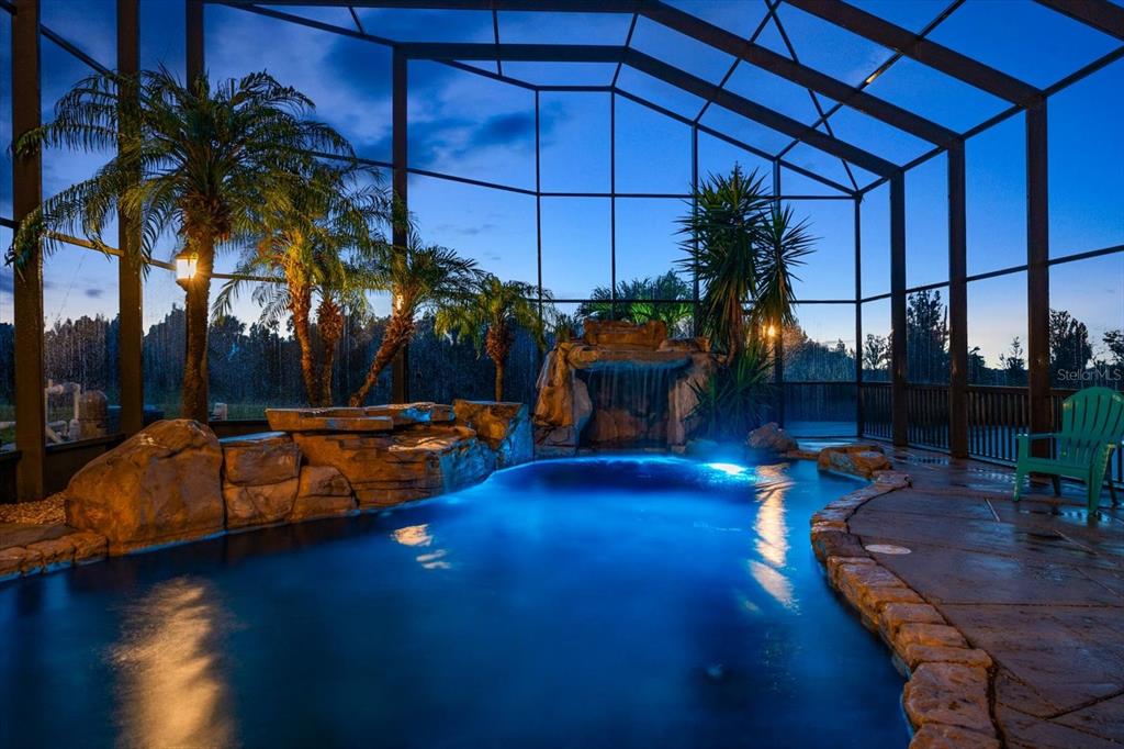 3397 Bluefish Drive Hernando Beach, FL 34607 - Photo 3 of 65 a view of a swimming pool with a table and chairs