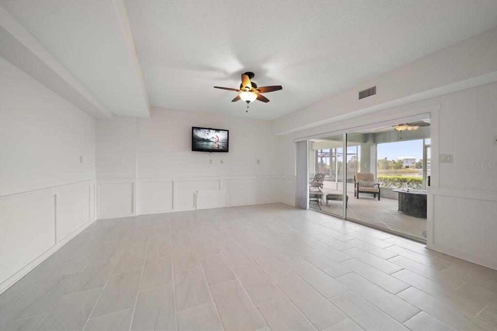 3397 Bluefish Drive Hernando Beach, FL 34607 - Photo 36 of 65 a view of a livingroom with furniture a ceiling fan and window