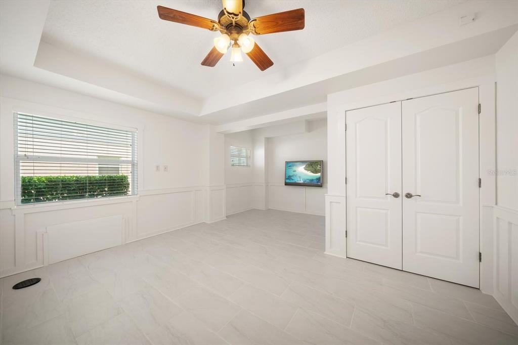 3397 Bluefish Drive Hernando Beach, FL 34607 - Photo 38 of 65 an empty room with ceiling fan and window