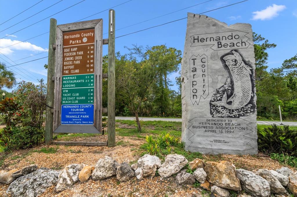 3397 Bluefish Drive Hernando Beach, FL 34607 - Photo 59 of 65 a sign that is sitting in front of a house