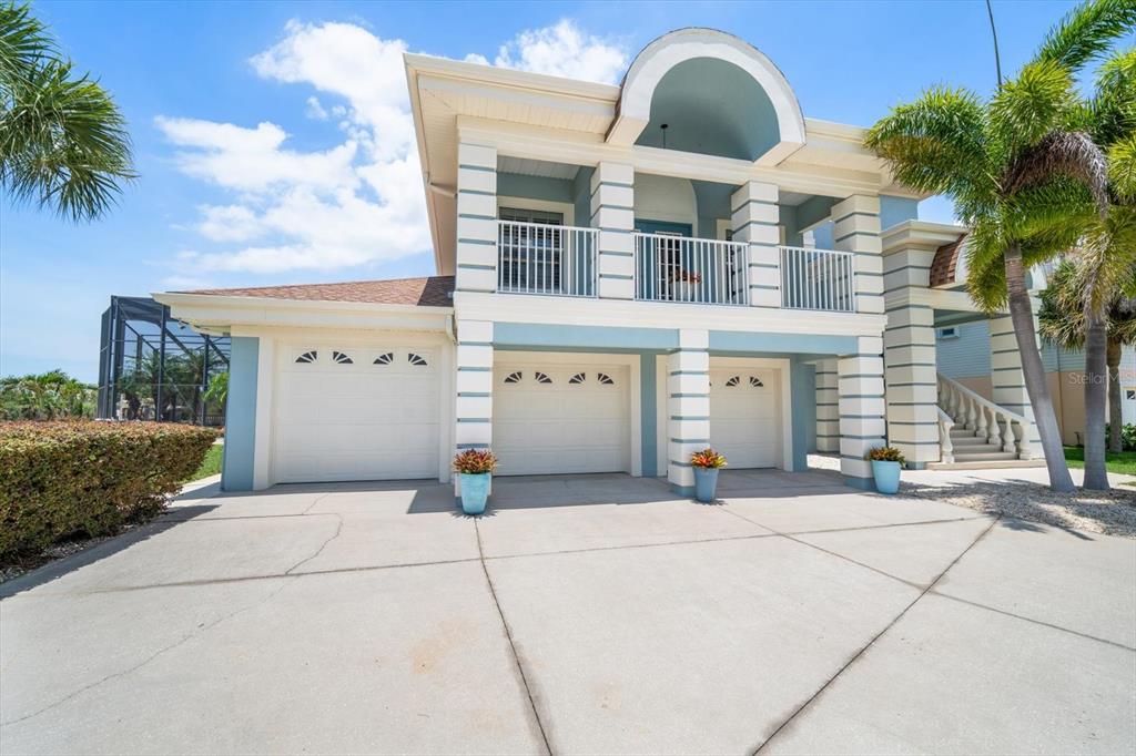 3397 Bluefish Drive Hernando Beach, FL 34607 - Photo 65 of 65 a front view of a house with yard