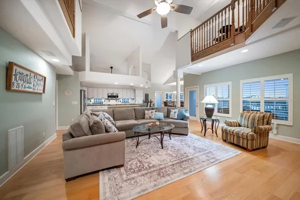 a kitchen with stainless steel appliances granite countertop a sink a washer and dryer next to a window
