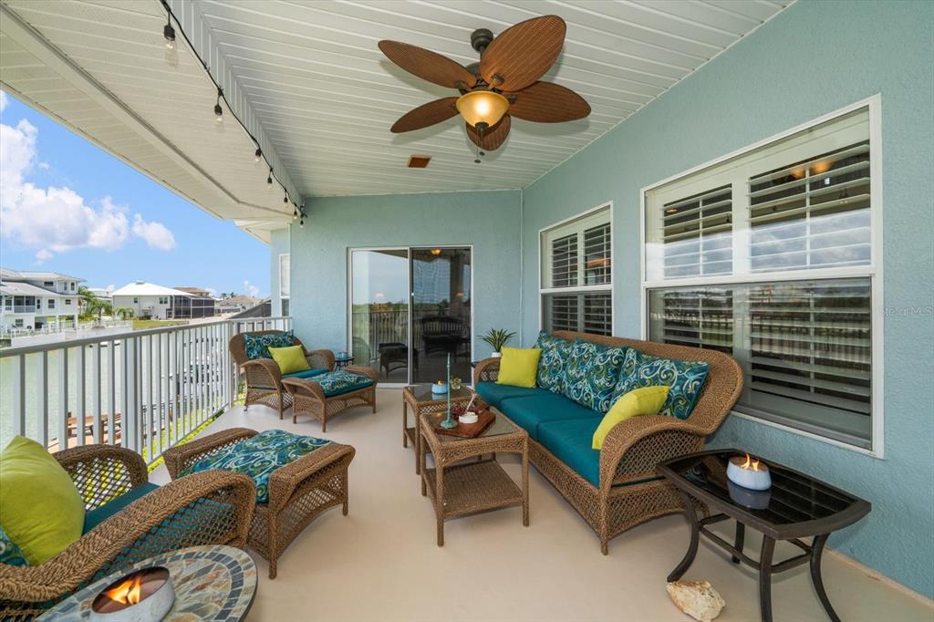 3397 Bluefish Drive Hernando Beach, FL 34607 - Photo 9 of 49 a living room with furniture and a large window