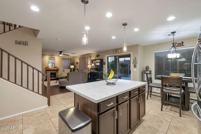 an open kitchen with a table and chairs