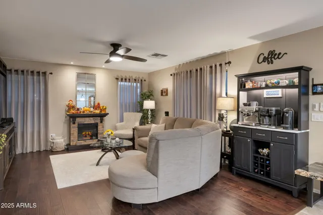 a living room with furniture and a fireplace