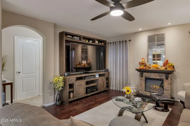 a living room with furniture and a fireplace