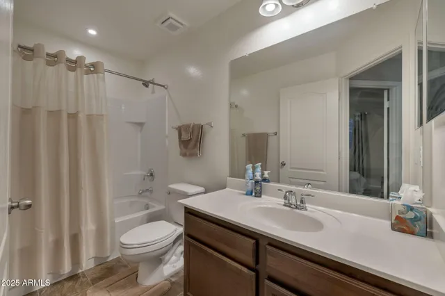a bathroom with a sink toilet a shower and a mirror