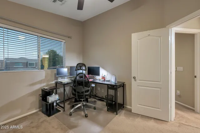 a view of a workspace with furniture