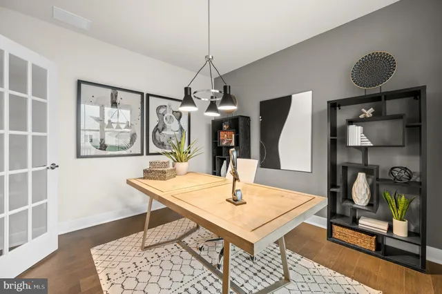 a view of a dining room with furniture and window