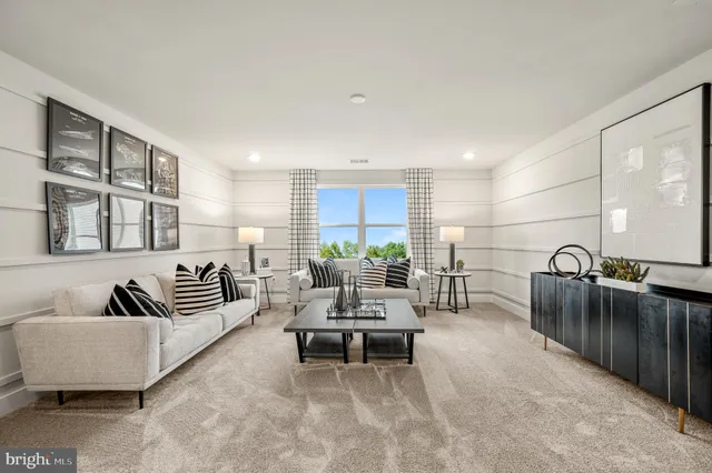 a living room with furniture and a rug
