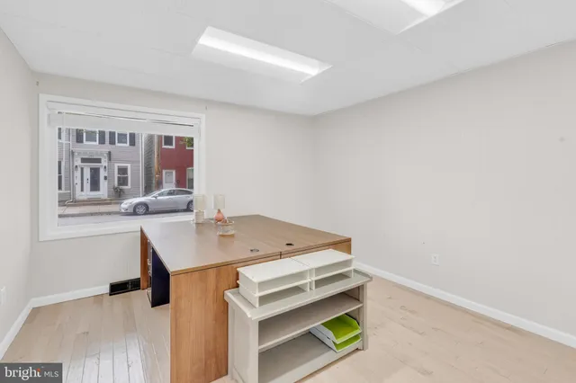 a bedroom with furniture and a potted plant