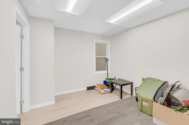 a utility room with cabinets washer and dryer