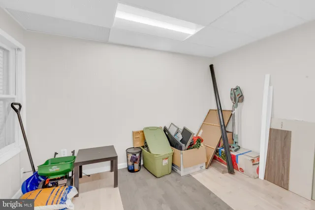 a room with a chair and dresser