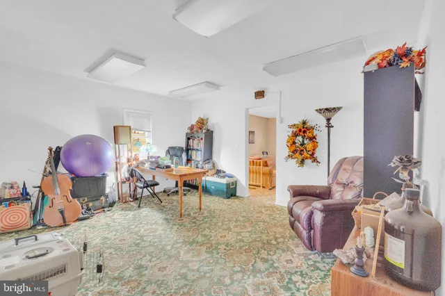 a view of a house with backyard and a slide