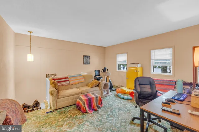 a view of a house with backyard and deck