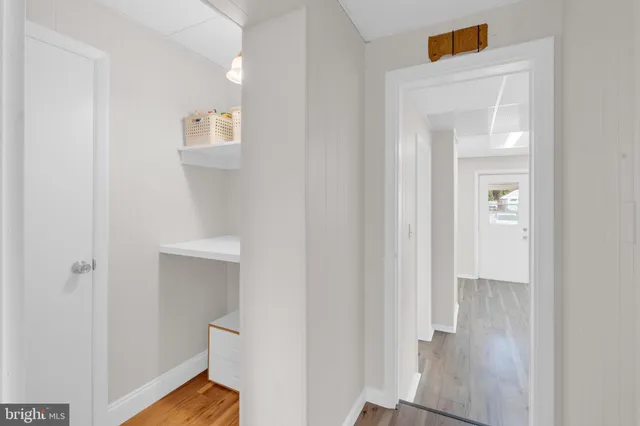 a view of a livingroom with furniture and wooden floor
