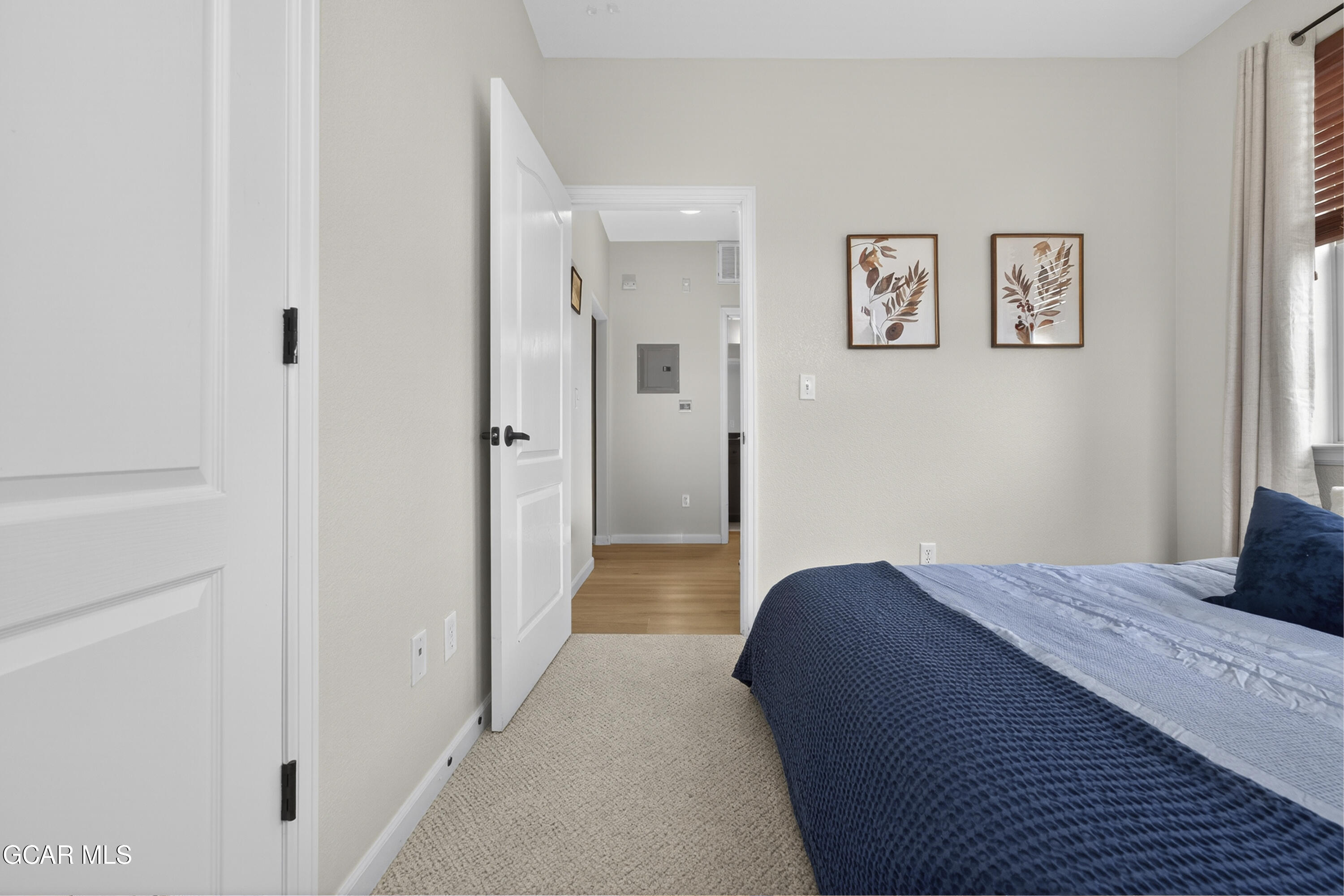 158 Village Road Granby, CO 80446 - Photo 19 of 46 a bedroom with a bed and painting on the wall