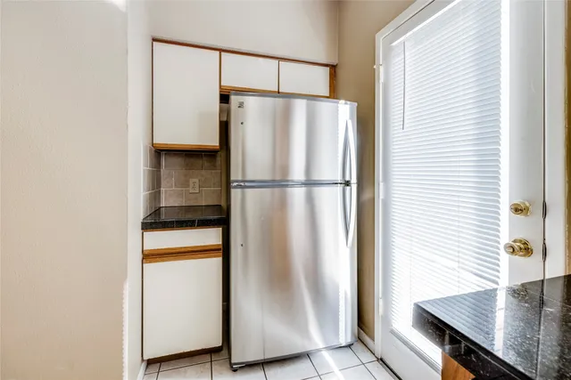 a view of an entryway with a chandelier fan
