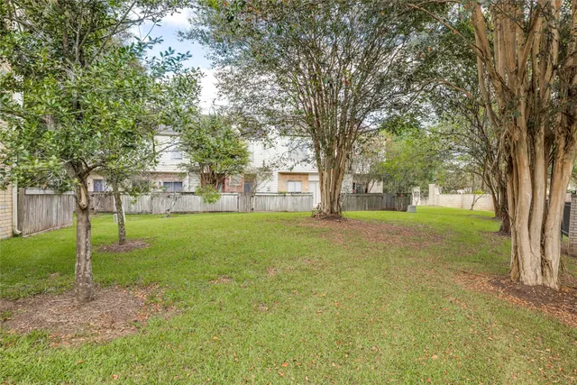 a view of a swimming pool with a yard