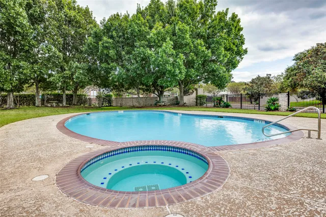 a view of a house with swimming pool and a yard