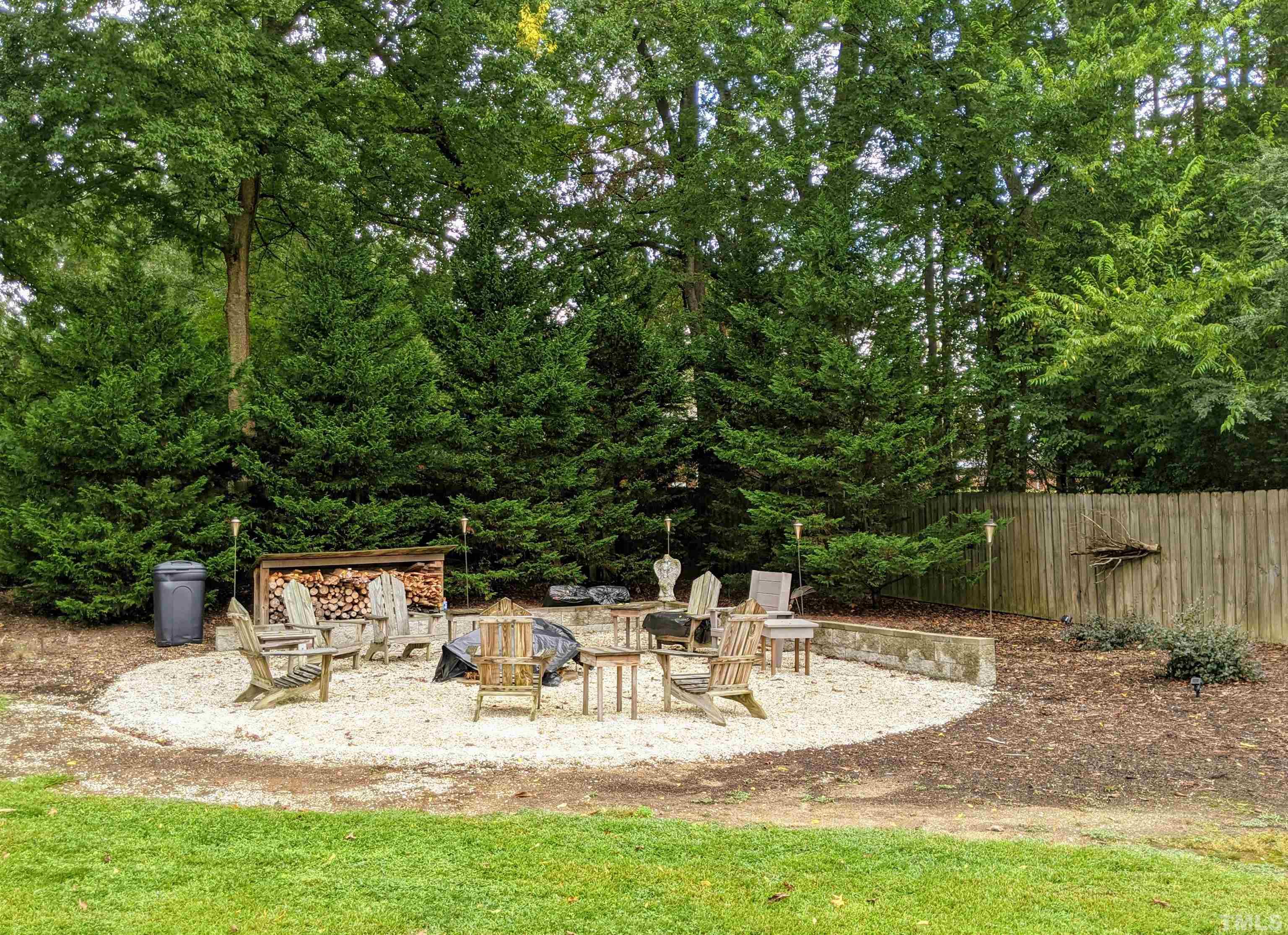 2405 Andor Place Raleigh, NC 27604 - Photo 14 of 30 a view of back yard with table and chairs