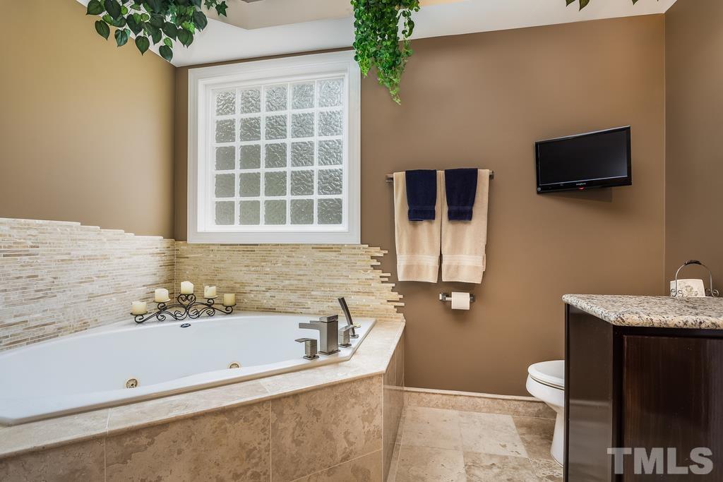 2405 Andor Place Raleigh, NC 27604 - Photo 15 of 30 a bathroom with a sink and a bathtub
