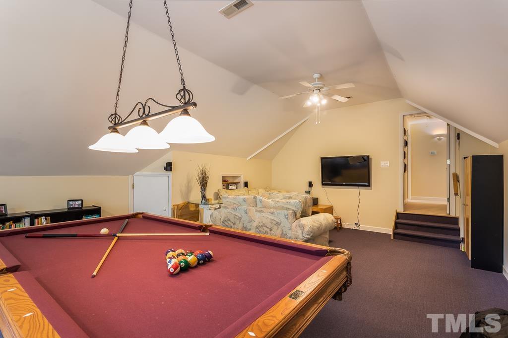 2405 Andor Place Raleigh, NC 27604 - Photo 17 of 30 a room with furniture and flat screen tv