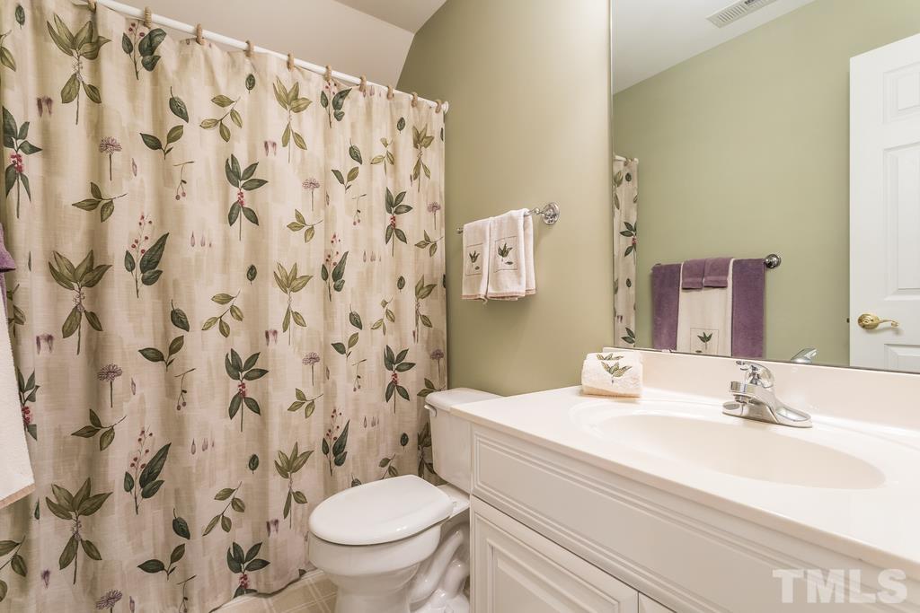 2405 Andor Place Raleigh, NC 27604 - Photo 20 of 30 a bathroom with a sink and a mirror