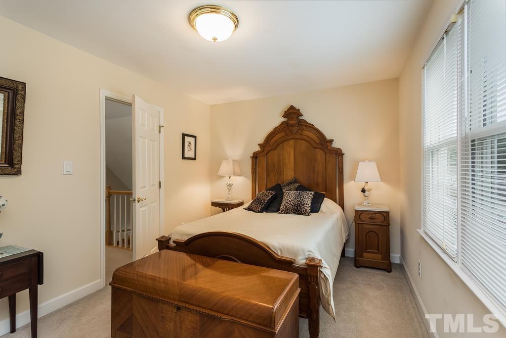 2405 Andor Place Raleigh, NC 27604 - Photo 21 of 30 a bedroom with a bed and a window
