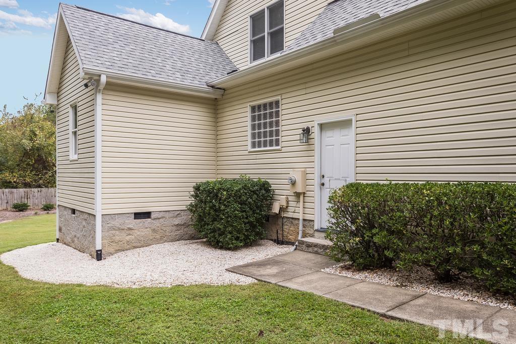 2405 Andor Place Raleigh, NC 27604 - Photo 26 of 30 a front view of a house with garden