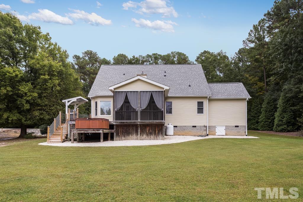 2405 Andor Place Raleigh, NC 27604 - Photo 28 of 30 a front view of a house with a garden and deck