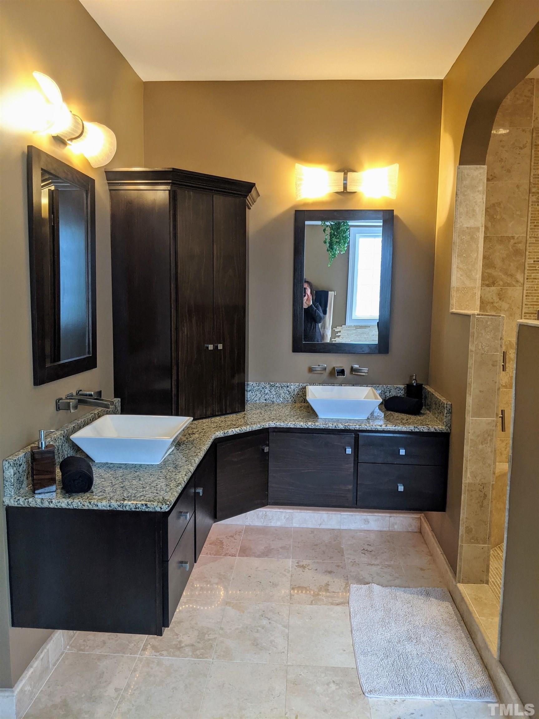 2405 Andor Place Raleigh, NC 27604 - Photo 10 of 30 a bathroom with a bathtub sink and mirror