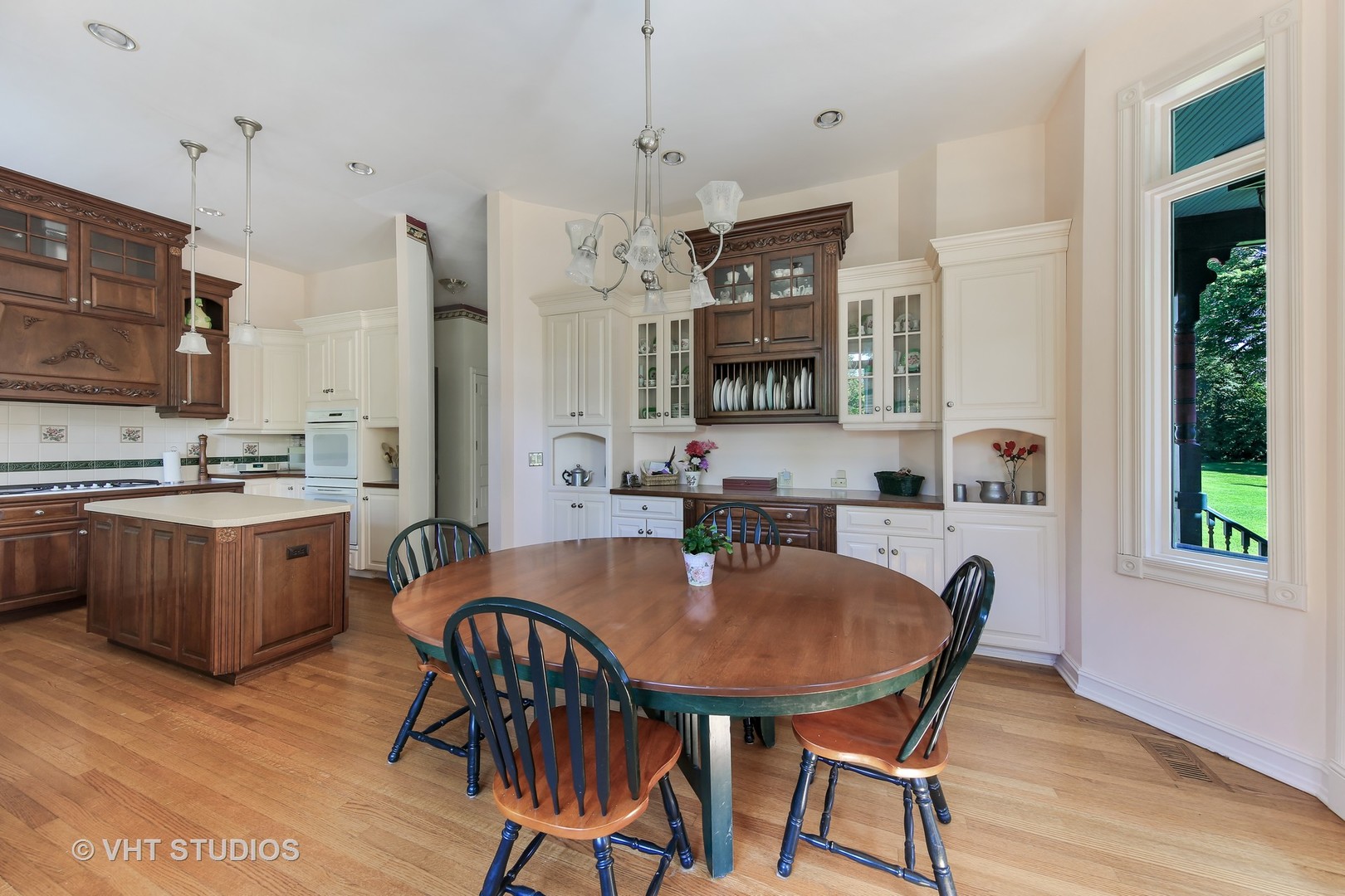 5324 Turvey Court Downers Grove, IL 60515 - Photo 8 of 27 a kitchen with a dining table chairs and refrigerator