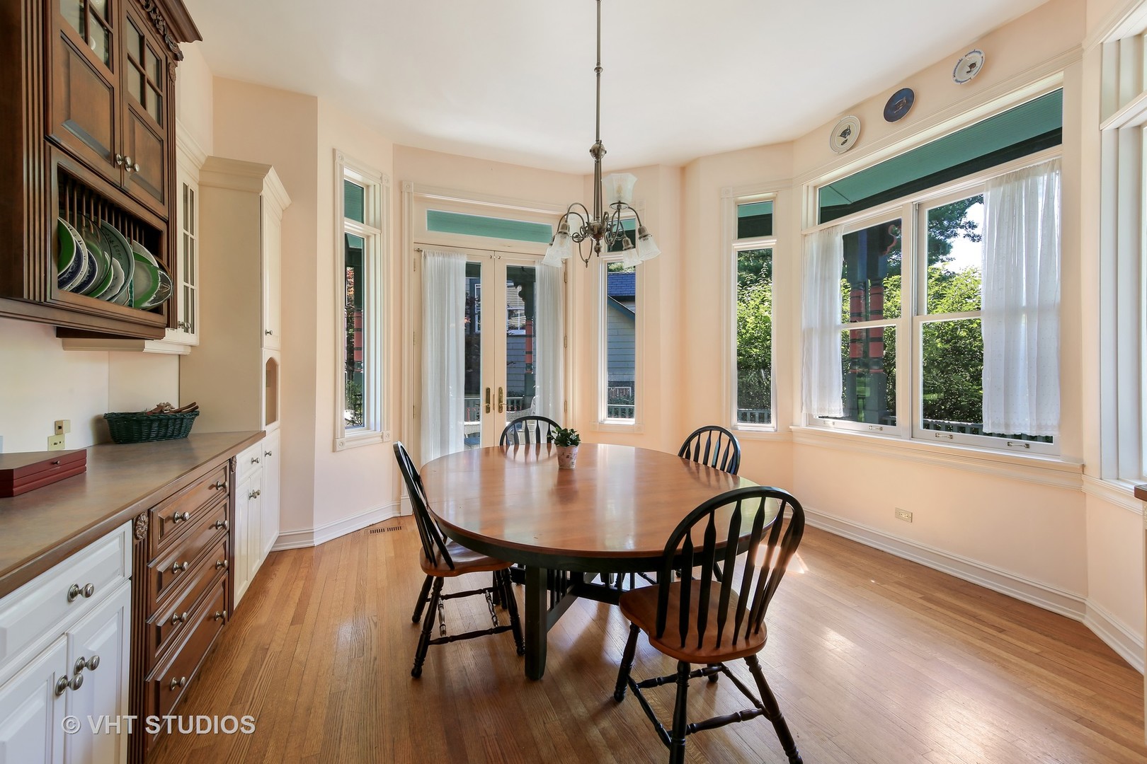 5324 Turvey Court Downers Grove, IL 60515 - Photo 10 of 27 a dining room with furniture a chandelier and wooden floor