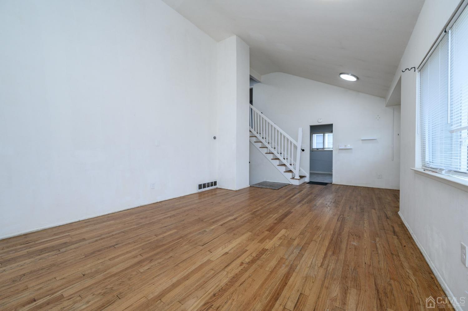 186 Central Avenue Edison, NJ 08817 - Photo 13 of 32 a view of empty room with wooden floor and fan