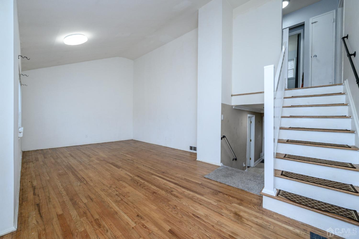 186 Central Avenue Edison, NJ 08817 - Photo 16 of 32 a view of a hallway with wooden floor and entryway