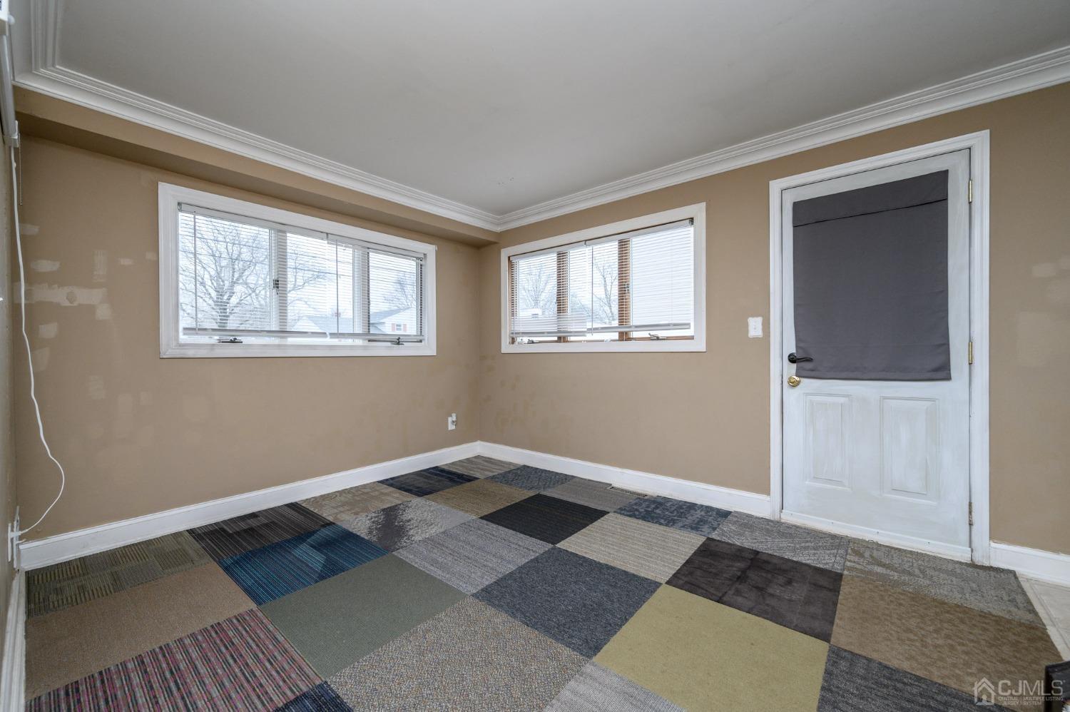 186 Central Avenue Edison, NJ 08817 - Photo 4 of 32 a view of an empty room with a window