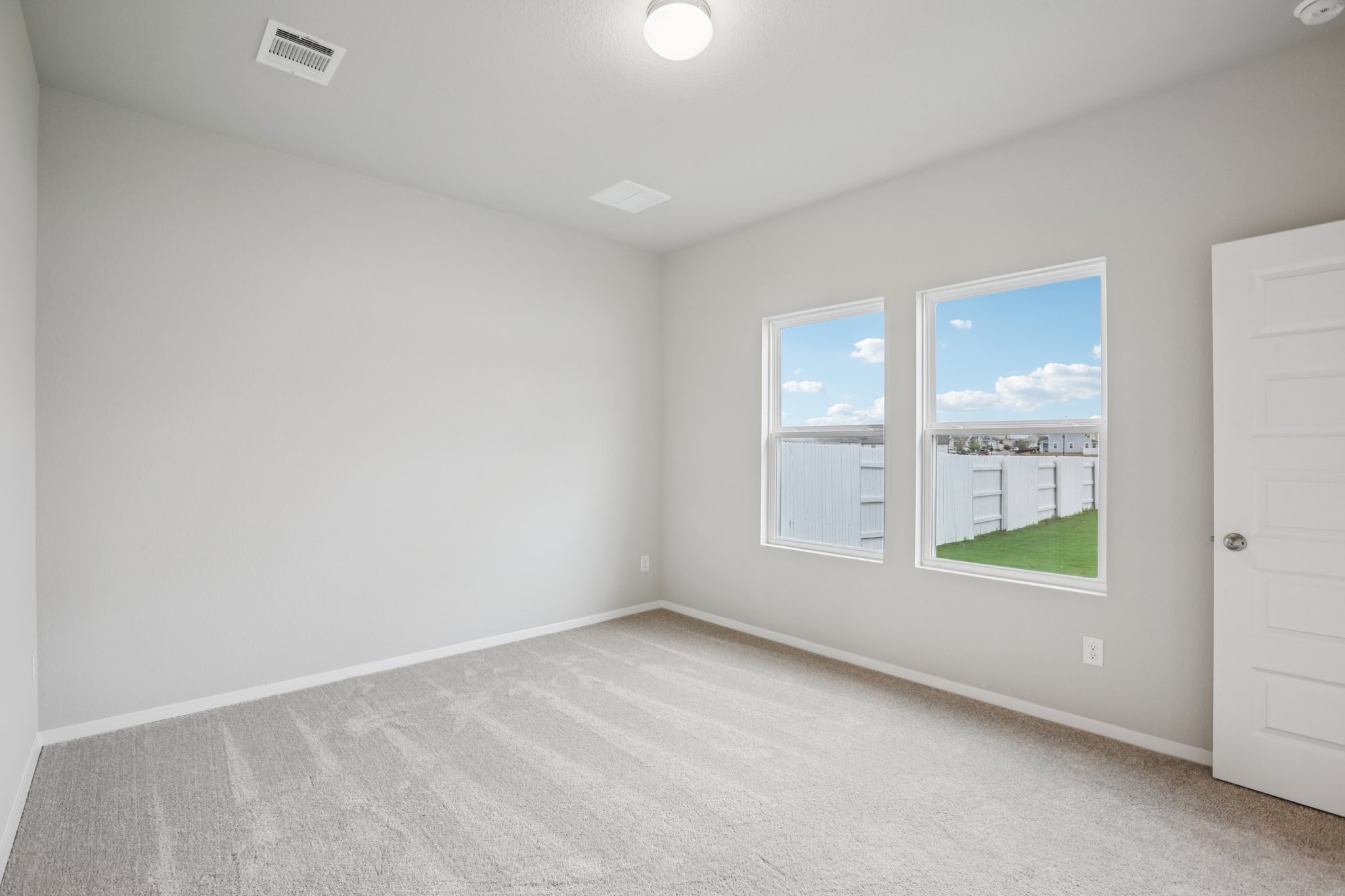 104 Summer Drive Elgin, TX 78621 - Photo 18 of 40 an empty room with windows