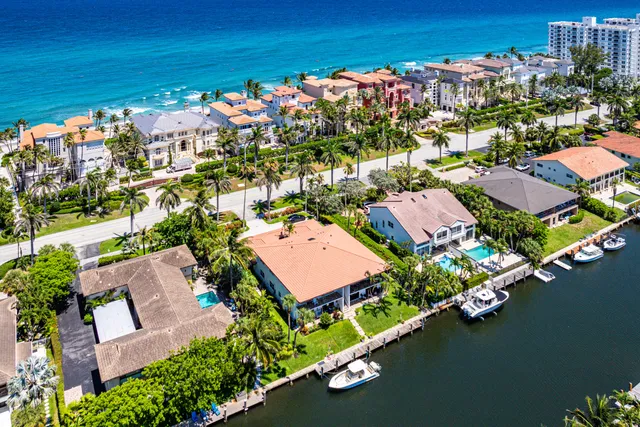 an aerial view of a house with a ocean view