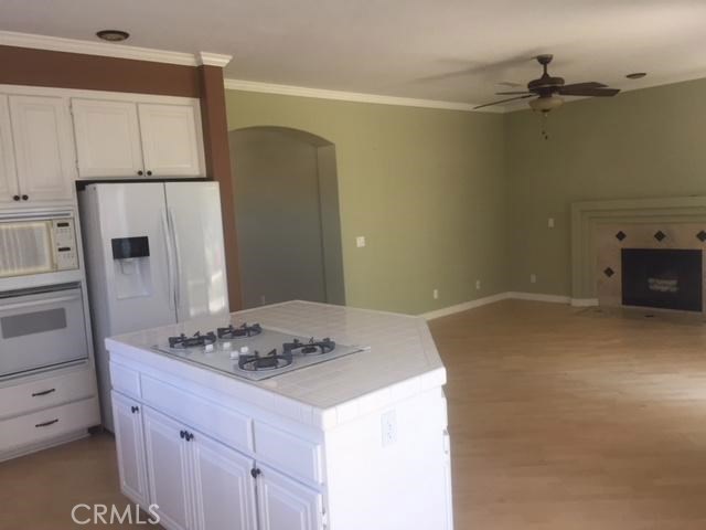 32184 Corte Daroca Temecula, CA 92592 - Photo 6 of 10 a kitchen with a sink and refrigerator