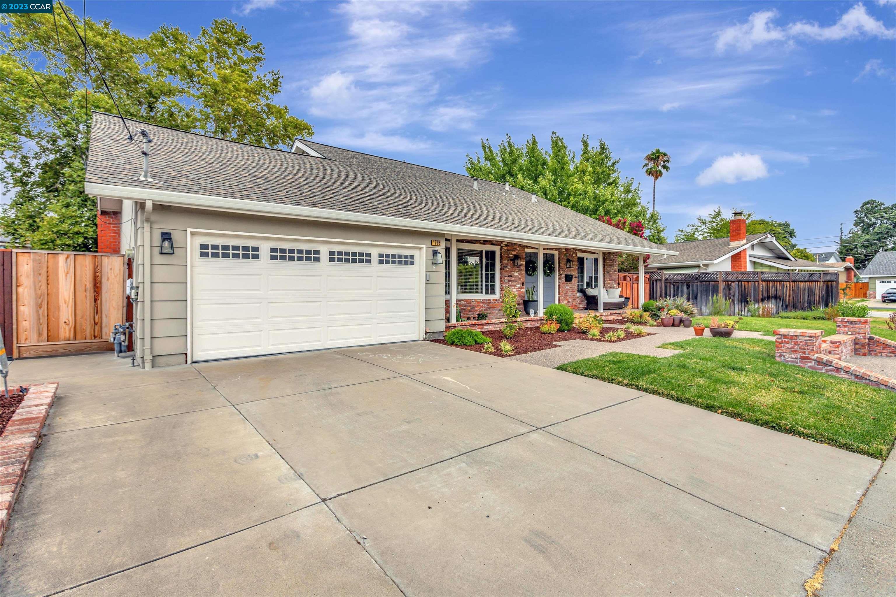 1795 Klier Drive Concord, CA 94518 - Photo 3 of 35 a patio with a table and chairs and potted plants