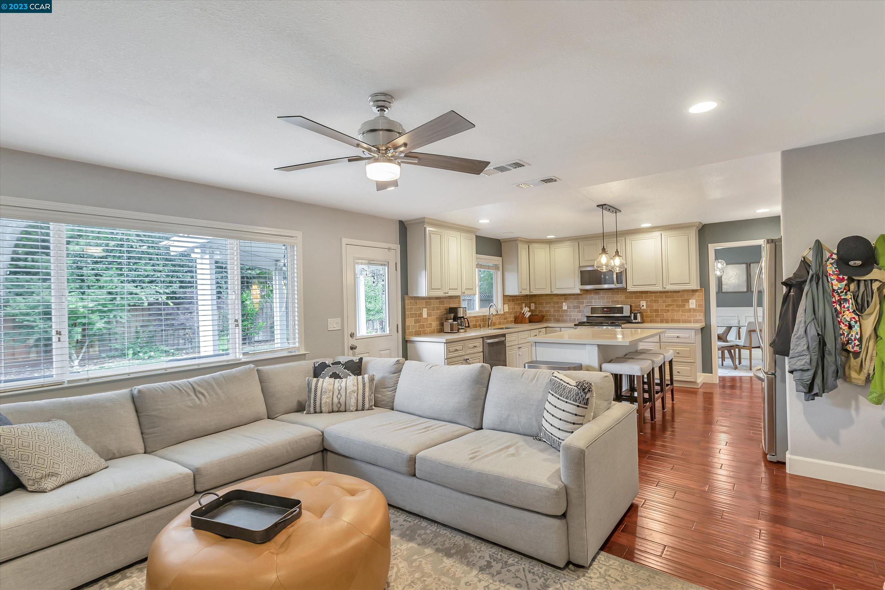 1795 Klier Drive Concord, CA 94518 - Photo 10 of 35 a living room with furniture and a large window with kitchen view