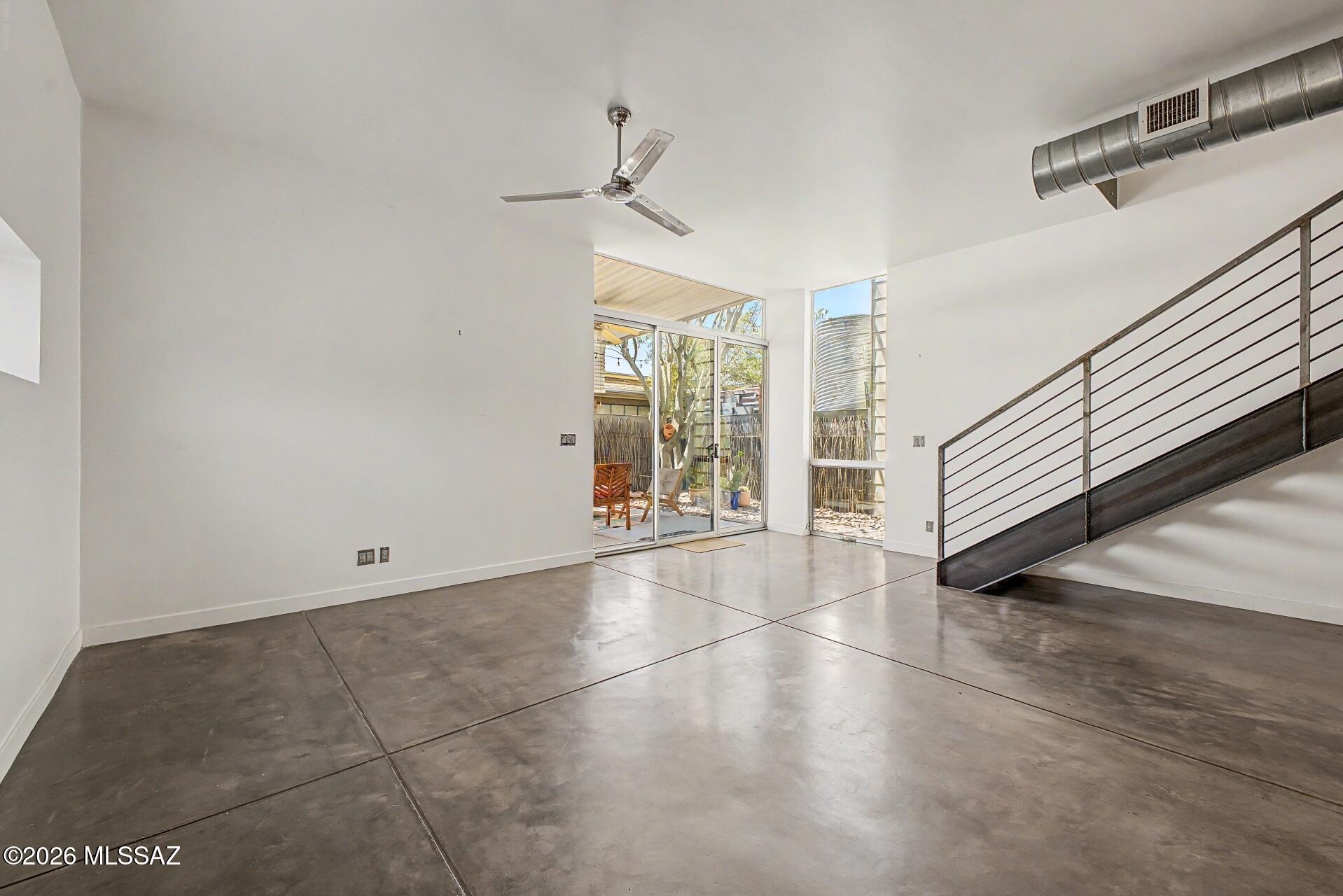 3605 East 3rd Street Tucson, AZ 85716 - Photo 11 of 39 Open concept dining/living areas with several floor to ceiling windows and access to the backyard.