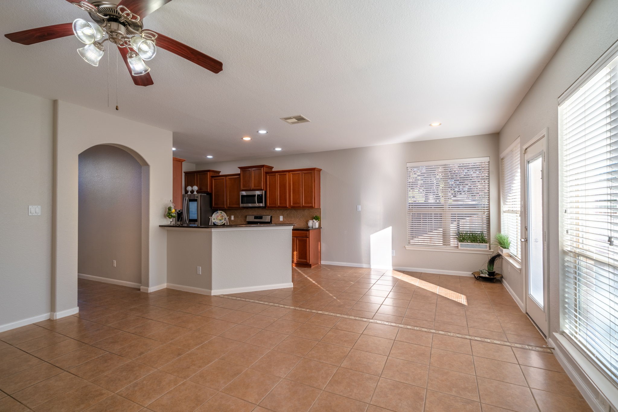 138 Magnolia Grove Lane Conroe, TX 77384 - Photo 13 of 43 a view of kitchen with refrigerator and window