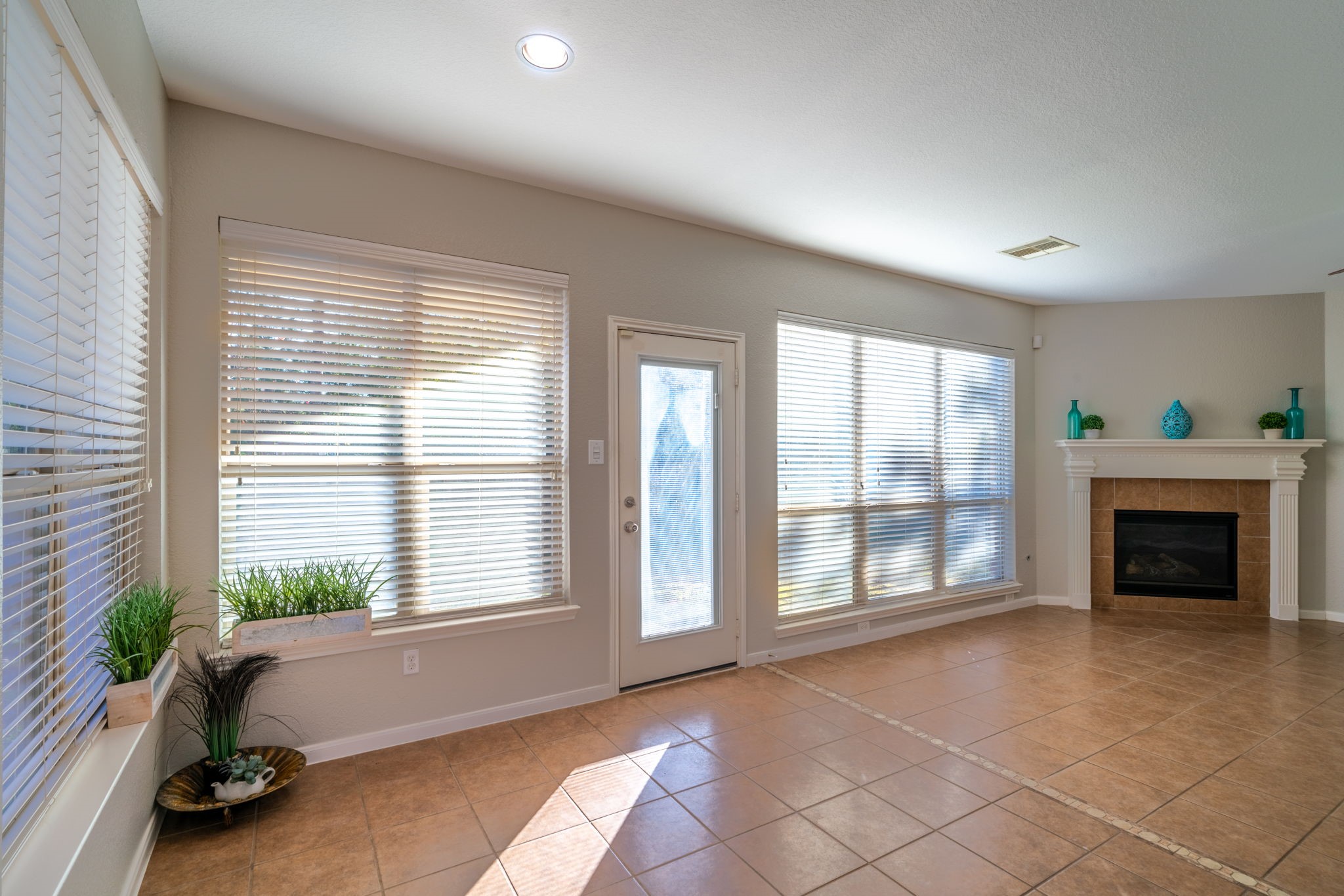 138 Magnolia Grove Lane Conroe, TX 77384 - Photo 16 of 43 an empty room with windows and fireplace