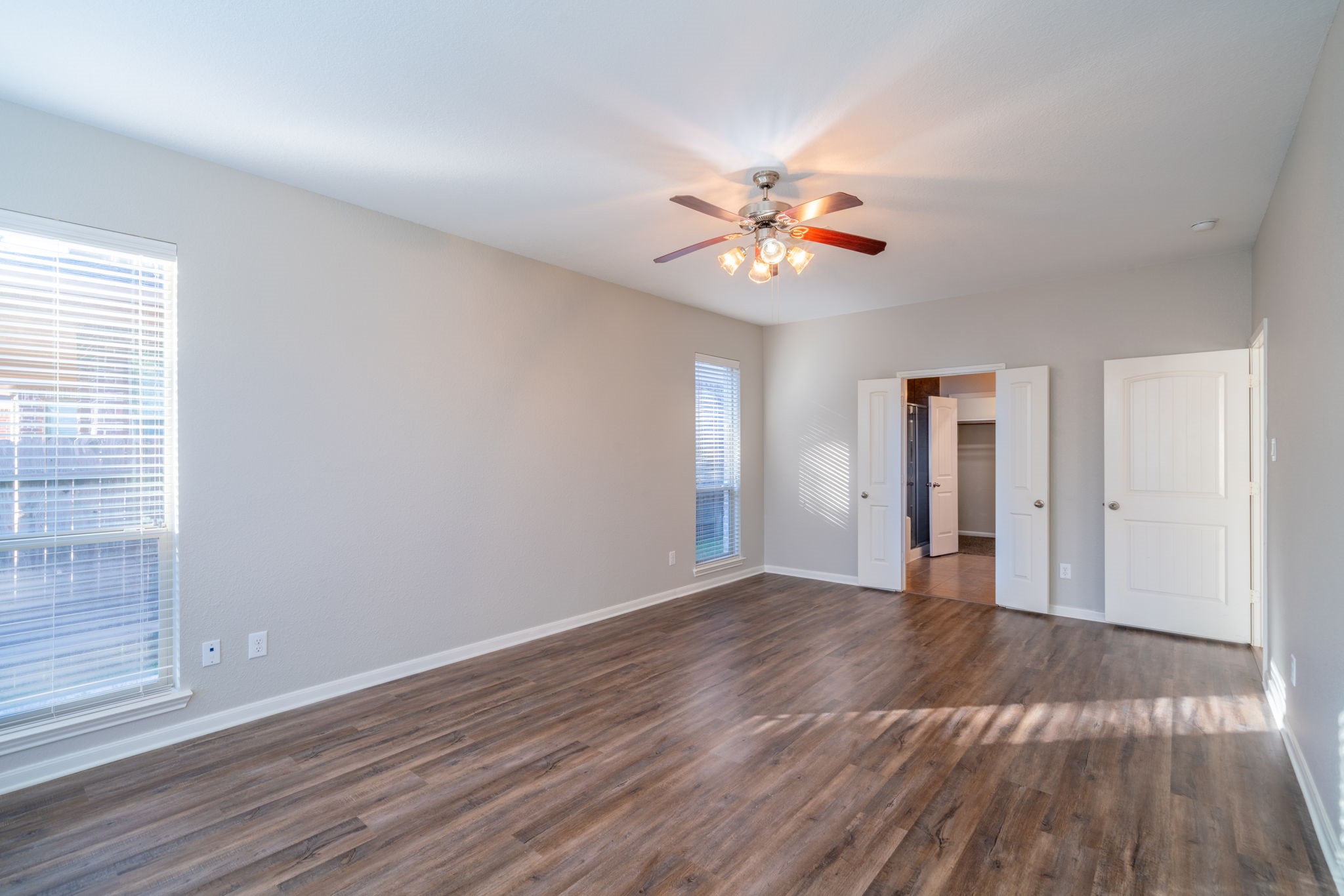 138 Magnolia Grove Lane Conroe, TX 77384 - Photo 20 of 43 a view of an empty room with window and wooden floor