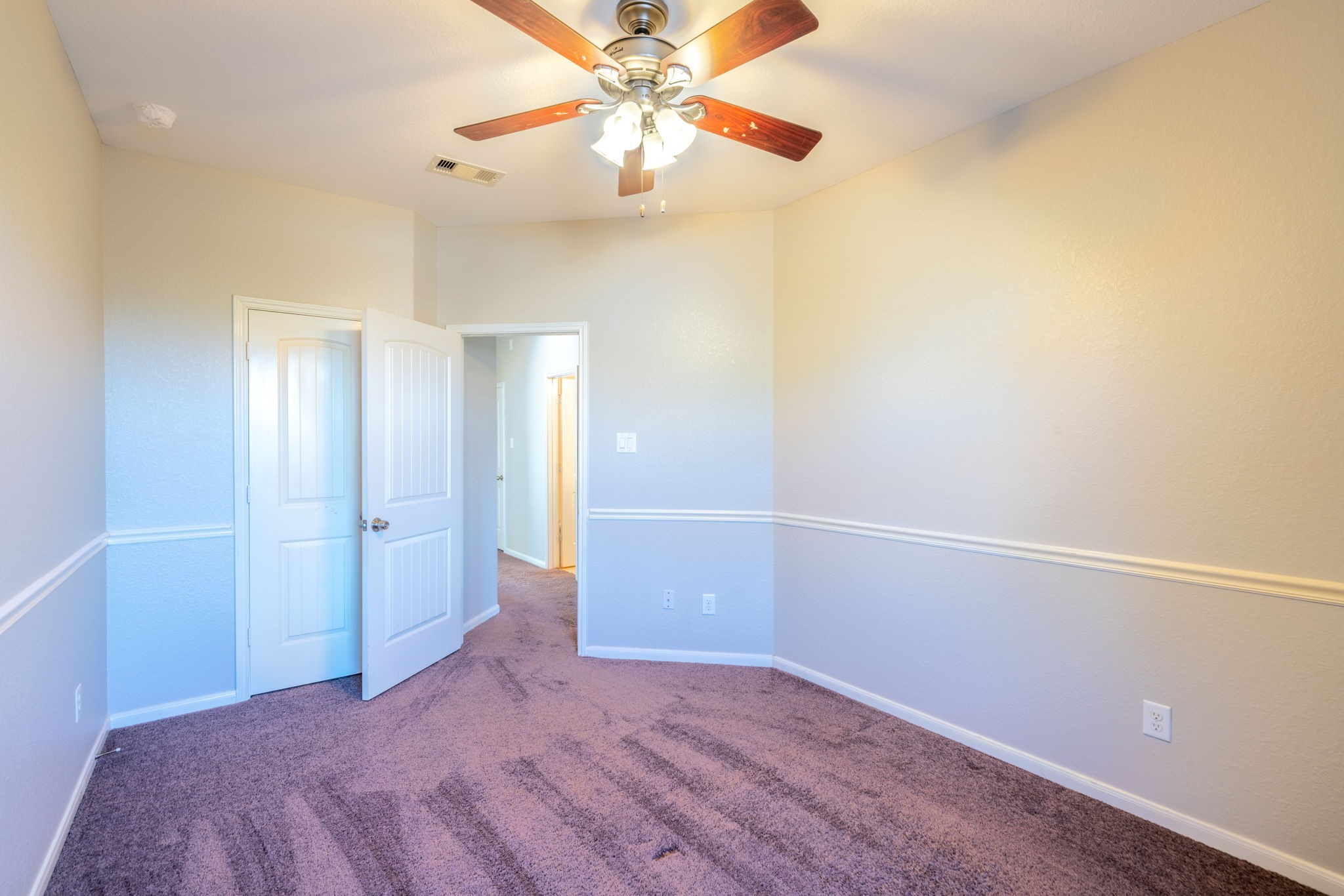 138 Magnolia Grove Lane Conroe, TX 77384 - Photo 27 of 43 an empty room with closet and a chandelier fan