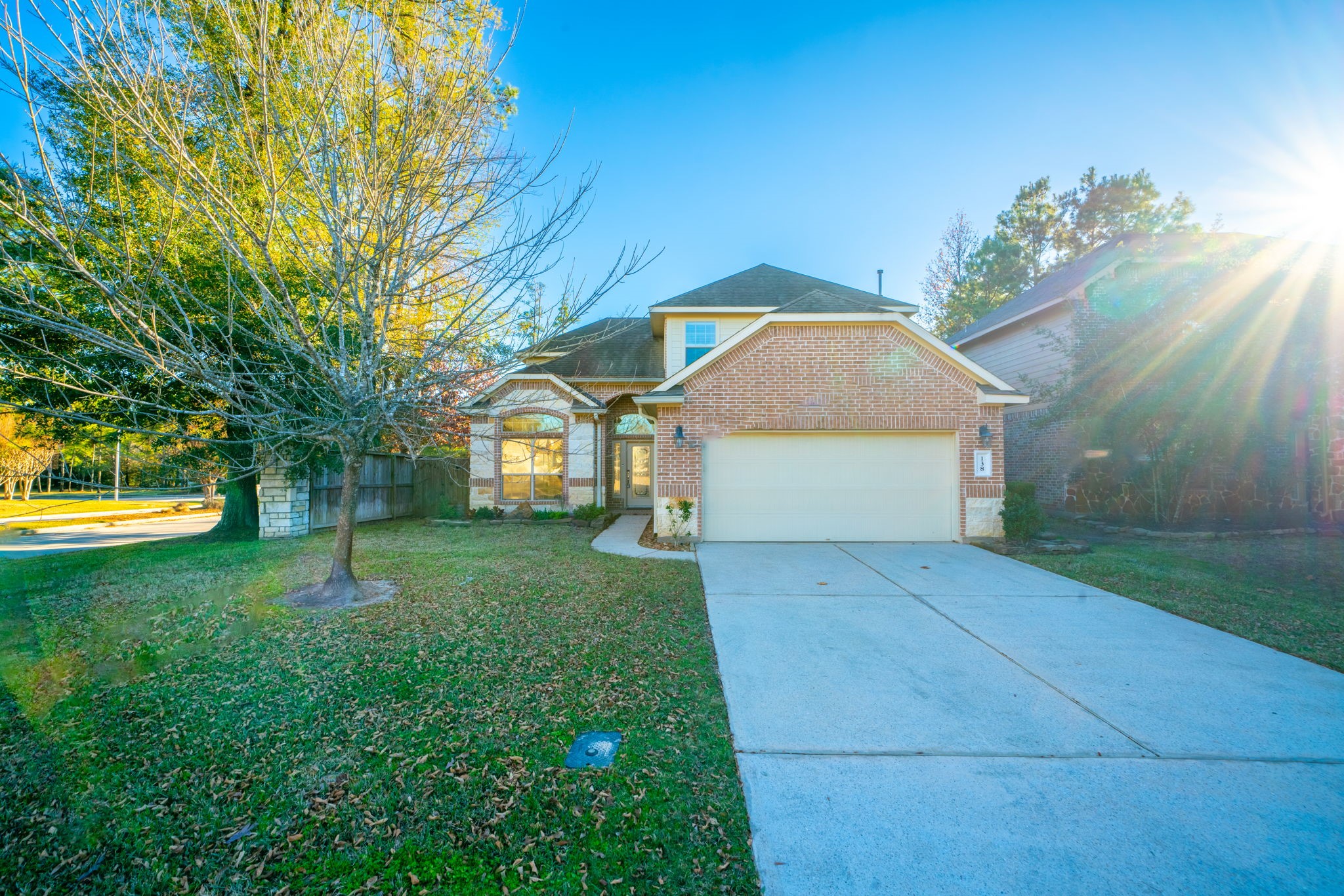 138 Magnolia Grove Lane Conroe, TX 77384 - Photo 3 of 43 a front view of a house with a yard