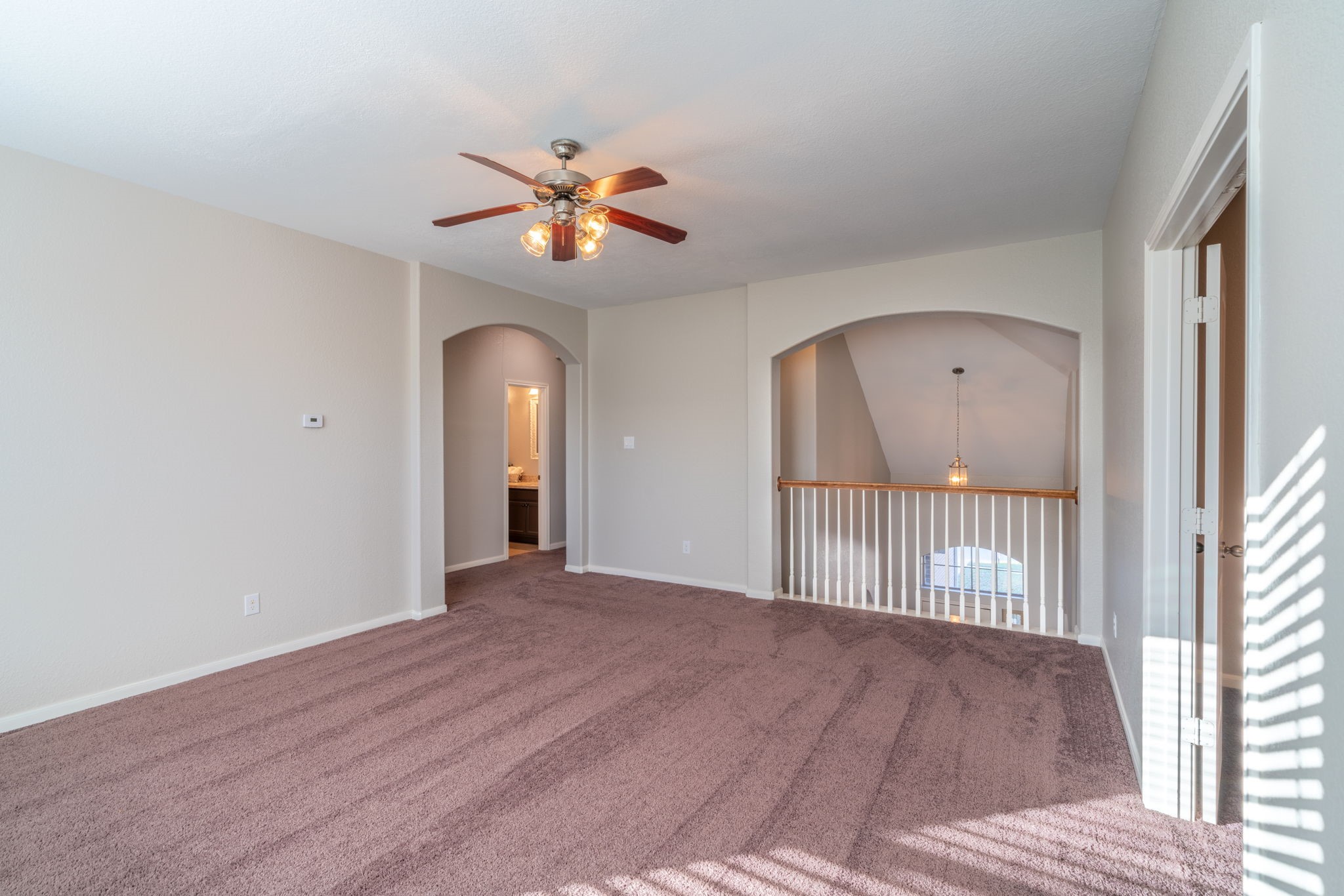 138 Magnolia Grove Lane Conroe, TX 77384 - Photo 34 of 43 a view of empty room with wooden floor and fan
