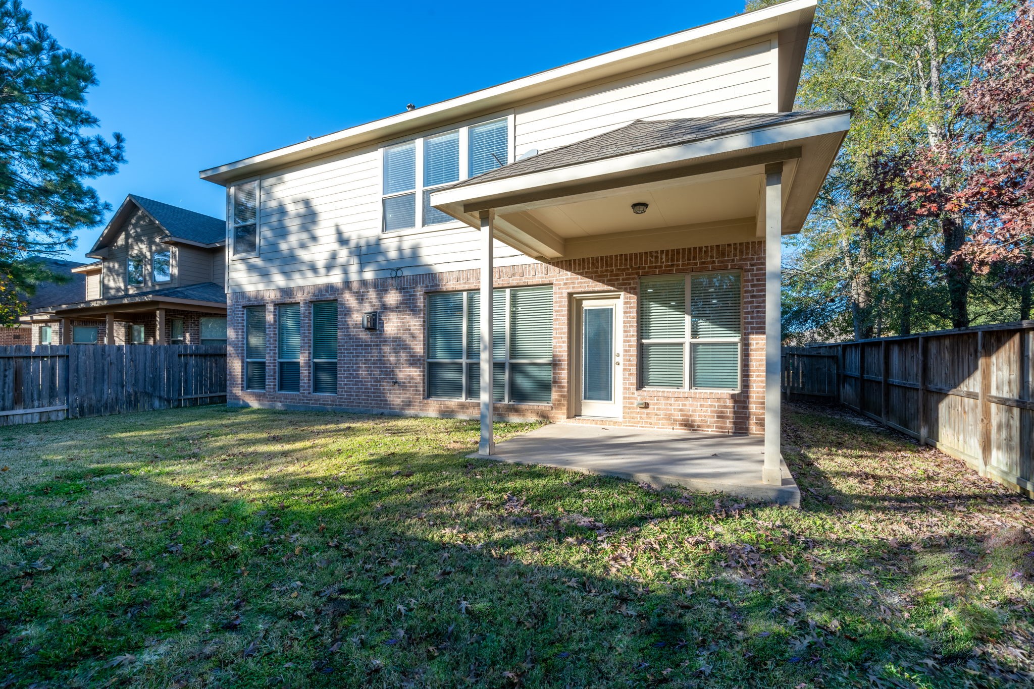 138 Magnolia Grove Lane Conroe, TX 77384 - Photo 40 of 43 a view of a house with backyard and sitting area